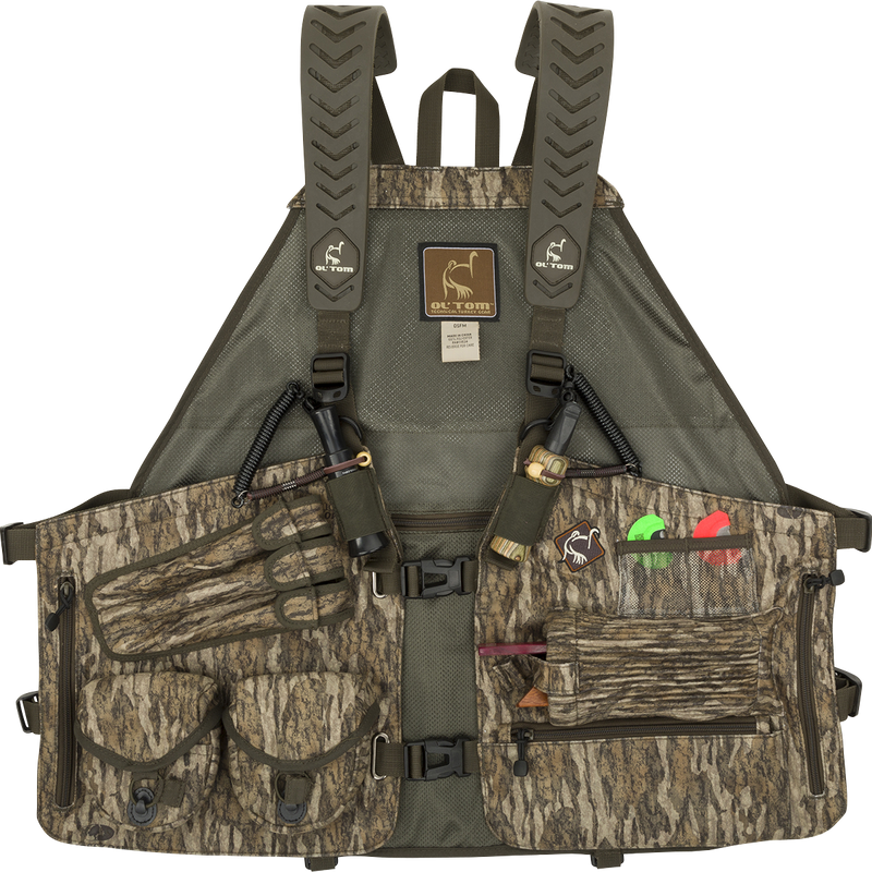 Time & Motion™ Gunslinger Turkey Vest - A camouflage vest with a well-organized design. Features multiple call pockets, detachable locator call cords, and storage compartments for gear. Comfortable and intuitive for easy access. Ideal for hunting and fishing.