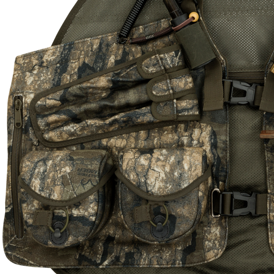 Time & Motion™ Gunslinger Turkey Vest - A close-up of a camouflaged vest with multiple pockets for calls and gear. Lightweight and well-organized for easy access.