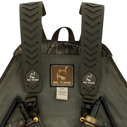 A close-up of the Time & Motion™ Gunslinger Turkey Vest, featuring a well-organized design with multiple pockets and straps for easy access to calls and gear.