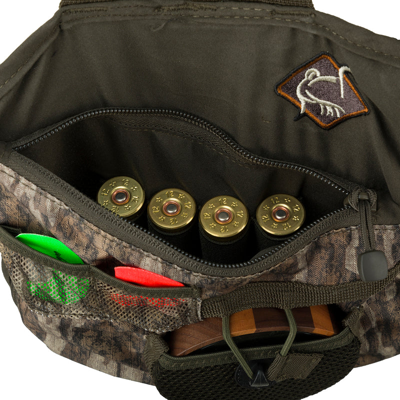Youth Time & Motion Easy-Rider Turkey Vest: Bag with cartridges, logo, and bullet close-ups. Detachable seat cushion, pockets for calls, adjustable straps.
