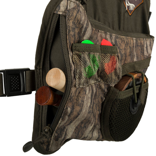 Youth Time & Motion Easy-Rider Turkey Vest: Close-up of a black bag with detachable seat cushion, zippered pockets, and shell loops. Adjustable straps for all sizes.