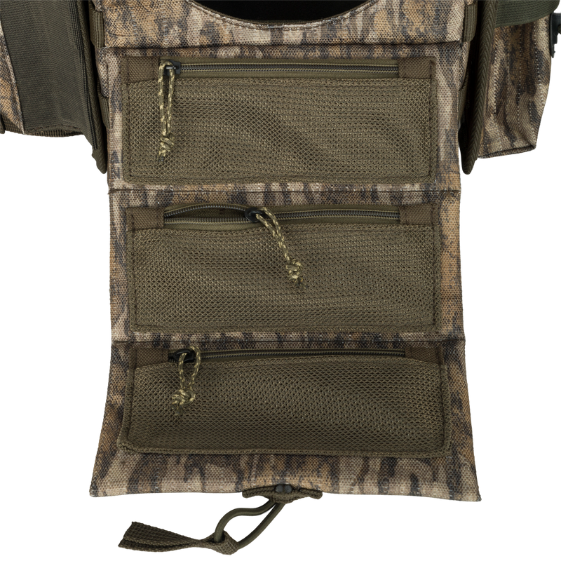 A lightweight Turkey Chest Pack made of durable 600D Polyester with multiple pockets and a stowable rain fly for hunting trips.