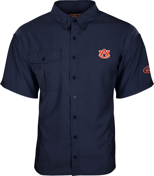 Auburn S/S Flyweight™ Shirt: A blue shirt with an emblem, designed for warm-weather outdoor activities. Made of 100% polyester Flyweight™ fabric for quick drying and breathability. Features include UPF 50+ sun protection, vented mesh back, and vertical chest pockets.