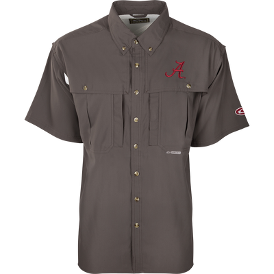 A close-up of the Alabama S/S Flyweight Wingshooter shirt, featuring a logo and red letter. Lightweight and breathable, with moisture-wicking fabric, vented back, and UPF 50+ sun protection. Magnattach™ and zippered pockets included.