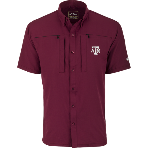 Texas A&M S/S Performance Stretch Button Up: A maroon shirt with logo, innovative design for style, comfort, and functionality. Performance fabrics provide breathability, flexibility, and range of movement. Half-button design prevents snagging.