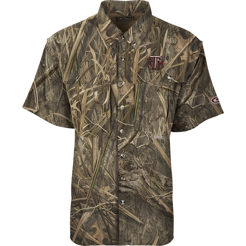 Texas A&M S/S Flyweight Wingshooter, a camouflage shirt with front and back heat vents, two chest pockets, and a logo, ideal for warm-weather outdoor activities.