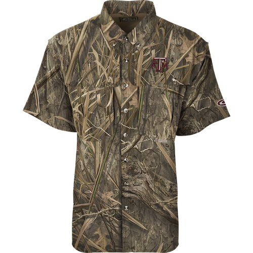 Texas A&M S/S Flyweight Wingshooter, a camouflage shirt with front and back heat vents, two chest pockets, and a logo, ideal for warm-weather outdoor activities.