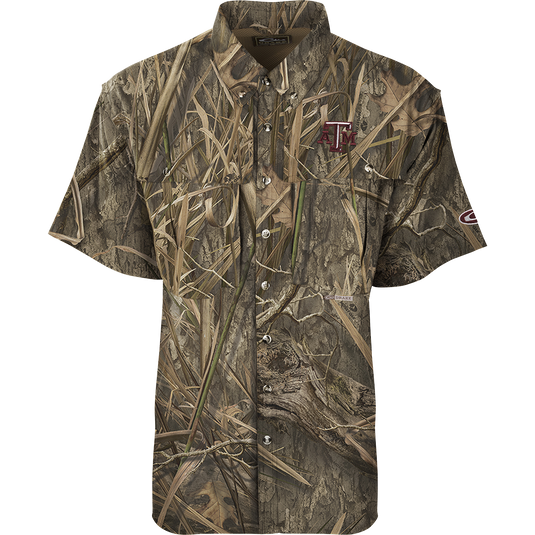 Texas A&M S/S Flyweight Wingshooter, a camouflage shirt with front and back heat vents, two chest pockets, and a logo, ideal for warm-weather outdoor activities.