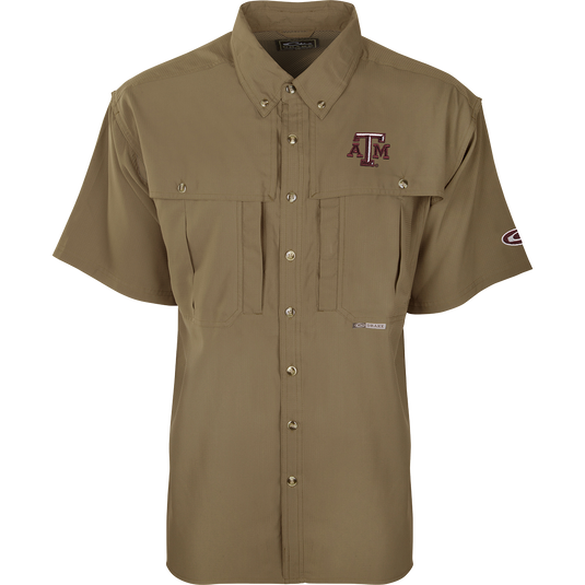 Texas A&M S/S Flyweight Wingshooter shirt with short sleeves, button-up design, visible chest pockets, and a prominent logo, ideal for warm-weather outdoor activities.