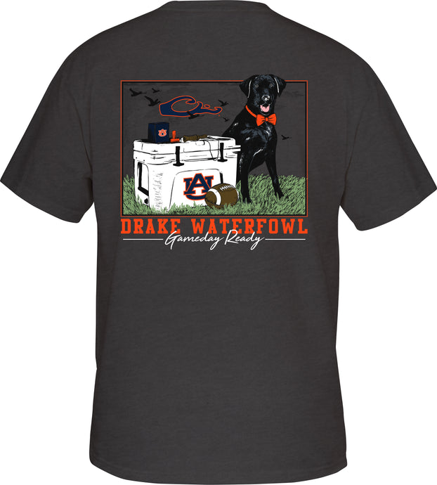Auburn Black Lab Tailgate Tee S/S: Back of a grey t-shirt with a black dog and orange bow tie, next to a cooler.