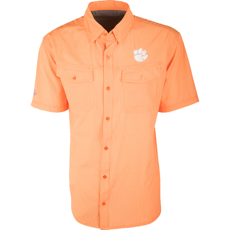 Clemson S/S Traveler's Shirt: A lightweight, wrinkle-resistant orange shirt with a white paw print. Ideal for football games or weekend tailgates.
