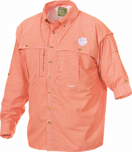 Clemson Plaid Wingshooter's Shirt Long Sleeve, a breathable and quick-drying shirt with front and back ventilation. Features roll-up tabs and Clemson University's Tiger Paw logo embroidered on left chest. Ideal for outdoor activities or casual office days.