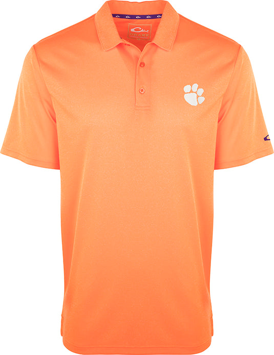 Clemson Vintage Heather Polo: An orange polo shirt with a paw print, perfect for any Tiger fan. Four-way stretch, quick-drying, moisture-wicking, and breathable. Official Clemson logo on left chest.