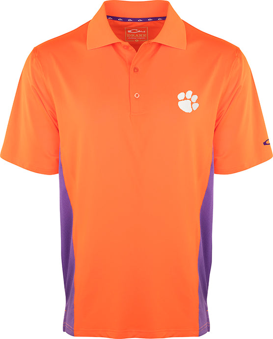 Clemson Performance Polo with Mesh Sides, an active shirt for Tiger fans. Moisture-wicking fabric and breathable mesh panels keep you cool. Official Clemson logo on left chest.