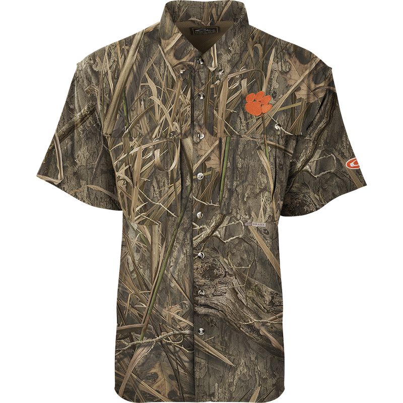 Clemson S/S Flyweight Wingshooter: Lightweight camouflage shirt with a flower, designed for warm-weather outdoor activities. Quick-drying, moisture-wicking, and breathable. Features Sol-Shield™ UPF 50+ sun protection, Magnattach™ vertical chest pocket, and a vertical zipper pocket.
