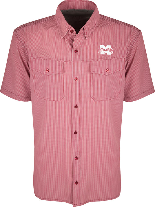 A red and white checkered shirt with collar, buttons, and short sleeves. Made with lightweight, breathable poly/spandex fabric for ultimate comfort and freedom of movement. Ideal for early season football games or weekend tailgates. Features moisture-wicking properties and 2 chest pockets with button flaps. Mississippi State S/S Traveler's Shirt.