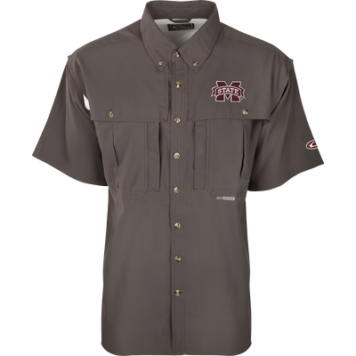 A close-up of the Mississippi State S/S Flyweight Wingshooter shirt with a logo on it, featuring a vented back design, quick-drying fabric, and multiple pockets for outdoor activities.