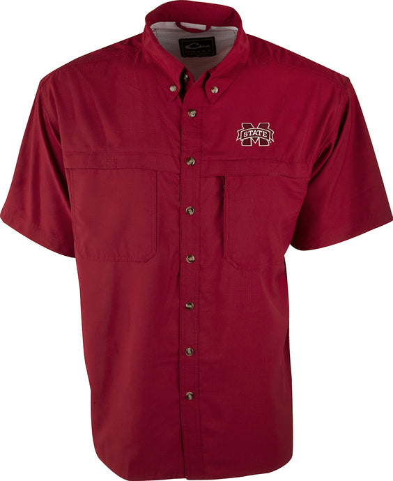 A red button-up shirt with Mississippi State logo embroidered on left chest. Short sleeve, mesh back, ultra-lightweight polyester construction. Quick-drying, moisture-wicking, and breathable. Horizontal chest pockets with velcro closures. Perfect for warm-weather outdoor activities.