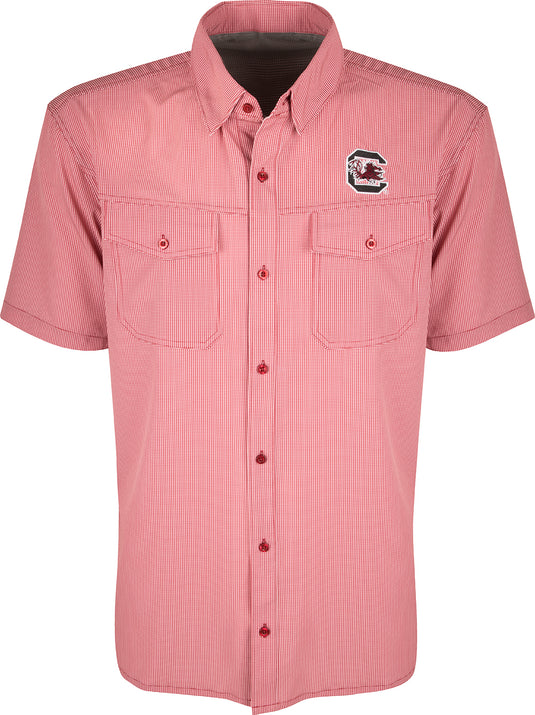 South Carolina S/S Traveler's Shirt: A lightweight, breathable checkered shirt with a logo on the left chest. Features four-way stretch fabric, moisture-wicking, and two chest pockets with button flaps. Ideal for early season football games or weekend tailgates with friends.