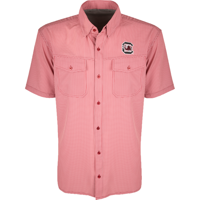 South Carolina S/S Traveler's Shirt - A lightweight, breathable plaid shirt with four-way stretch for freedom of movement. Features moisture-wicking fabric, button flaps on chest pockets, and a South Carolina logo embroidered on the left chest. Ideal for early season football games or weekend tailgates with friends.