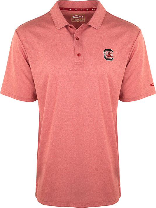 South Carolina Vintage Heather Polo: A red polo shirt with the official South Carolina logo on the left chest. Made of 100% polyester with a vintage heather finish. Features four-way stretch, quick-drying, moisture-wicking, and breathable fabric. Perfect for Gamecocks fans.