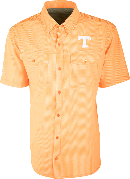 Tennessee S/S Traveler's Shirt, a lightweight, breathable shirt with a logo on the left chest. Ideal for early season football games or weekend tailgates. Features moisture-wicking fabric and two chest pockets with button flaps.