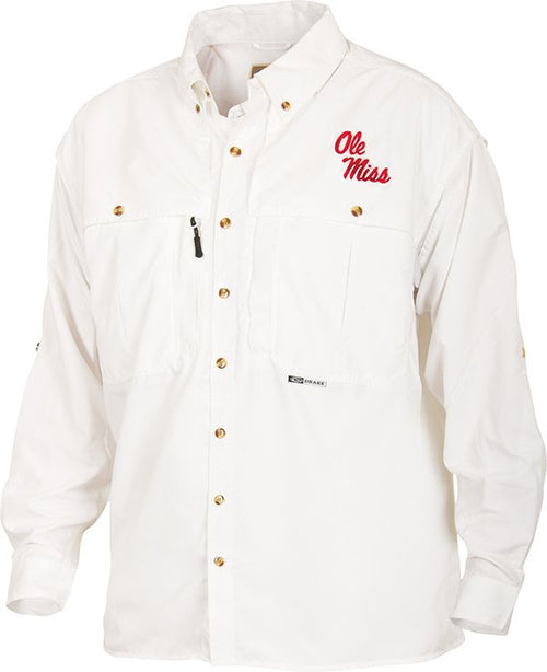 Ole Miss Wingshooter's Shirt Long Sleeve: A white shirt with a logo, featuring a seven-button design, front and back ventilation, and multiple chest pockets. Breathable, cool, and quick-drying, it's perfect for Game Day. Made with 100% polyester twill fabric and poly-mesh lining in vented areas. Wrinkle-resistant EasyCare™ fabric. From Drake Waterfowl, a store known for high-quality hunting gear and clothing.