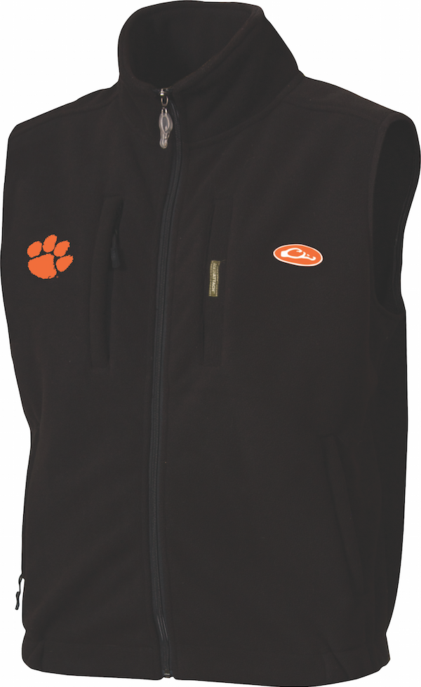 Clemson Windproof Layering Vest: A black vest with a logo on the right chest. Windproof and water-resistant, made of 100% polyester ultra-warm fleece. Features a stand-up collar, zippered license/key pocket on chest, Magnattach™ chest call pocket, and lower hand-warmer pockets.