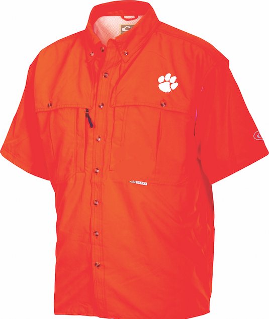 Clemson Wingshooter's Shirt: Orange shirt with paw print. Breathable, quick-drying polyester fabric. Features vented areas, chest pockets, and zippered pocket. Ideal for Game Day.