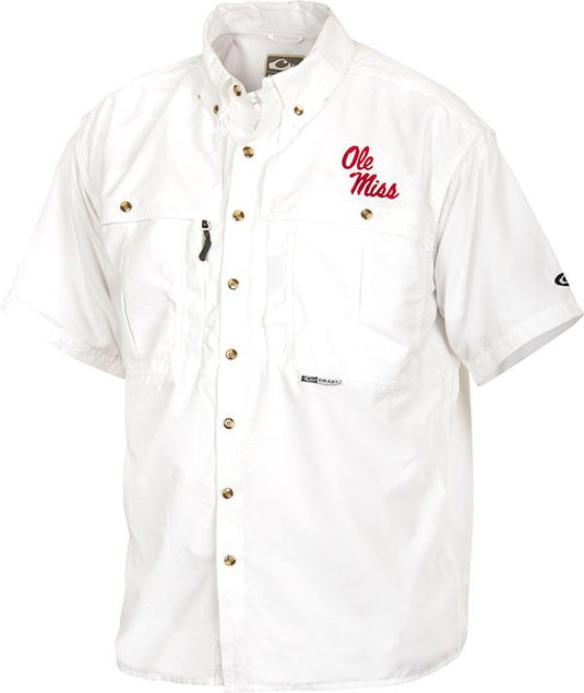 Ole Miss Wingshooter's Shirt Short Sleeve: A white shirt with a logo, perfect for Game Day. Breathable, cool, and quick-drying. Features front and back ventilation, oversized chest pockets, and a Magnattach™ pocket. Made with 100% Polyester twill fabric and 100% Poly-mesh lining in vented areas. From Drake Waterfowl, a store known for high-quality hunting gear and clothing.