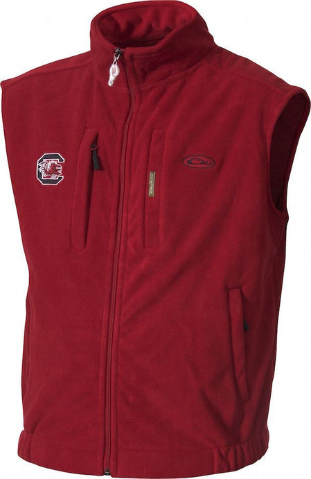 South Carolina Windproof Layering Vest: A red vest with a logo on the right chest. Windproof and water resistant, made of 100% polyester fleece. Features a stand-up collar, zippered pocket, and handwarmer pockets. Ideal for hunting and outdoor activities.