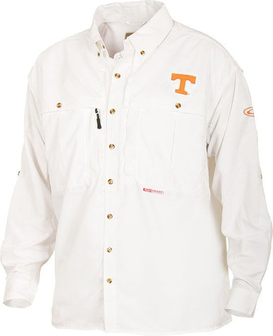 A white long-sleeved Tennessee Wingshooter's Shirt with logo. Breathable, quick-drying polyester fabric with front and back ventilation. Magnattach™ and zippered pockets for convenience. Ideal for Game Day.
