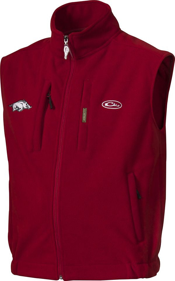 Arkansas Windproof Layering Vest with logo embroidery. Red vest with stand-up collar, zippered pocket, and hand warmer pockets. Windproof, water resistant, ultra-warm fleece. High quality hunting gear.