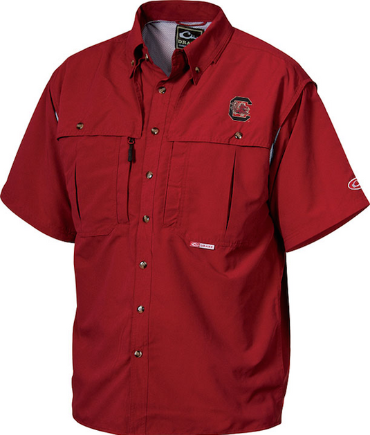 South Carolina Wingshooter's Shirt S/S: Breathable red shirt with logo, seven-button design, front and back ventilation, oversized chest pockets, and zippered pockets. Perfect for Game Day.